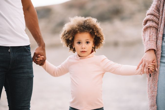 Stylish multiethnic family walking on nature
