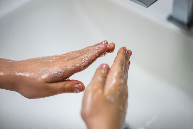 Antivirus concept of hands being washed in suds