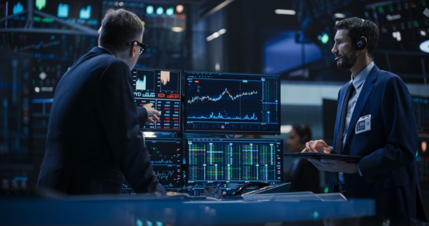 Stock Exchange Professionals Discussing Buy and Sell Options For Different Bonds