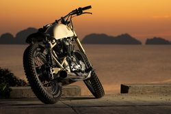 Motorbike near sea during sunset