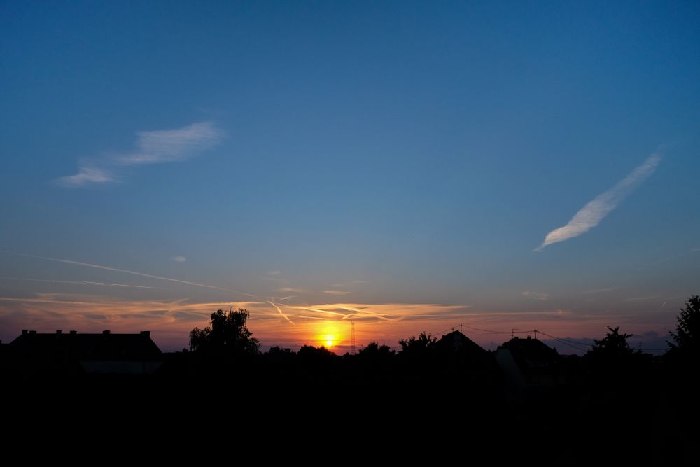 Colorful sunset over French rooftops