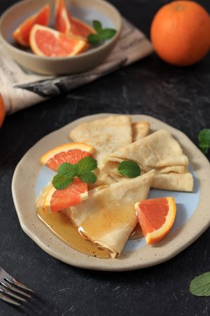 Traditional French Crepe Suzette with Orange and Honey Sauce.
