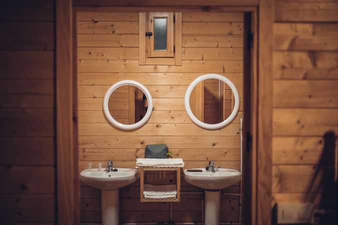 Bathroom in wooden house with opened door