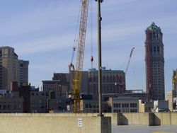 Yellow crane near buildings in the city