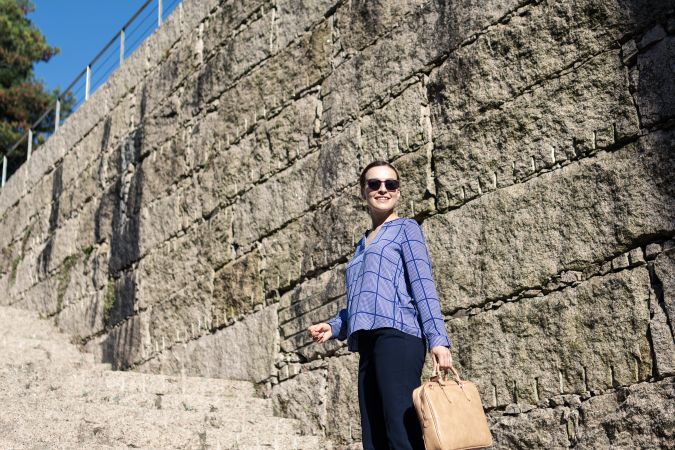 Businesswoman climbing up street stairs