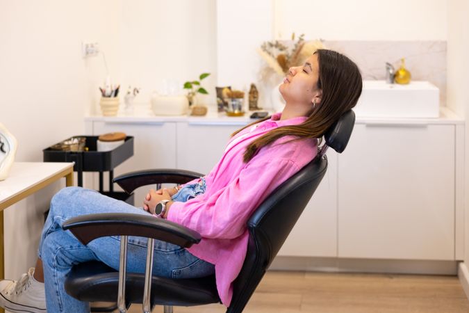 Beautician making eyebrow design and lamination procedures