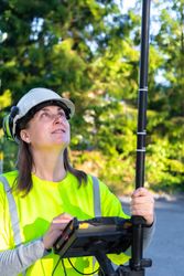 Woman working on measurement machine outdoor