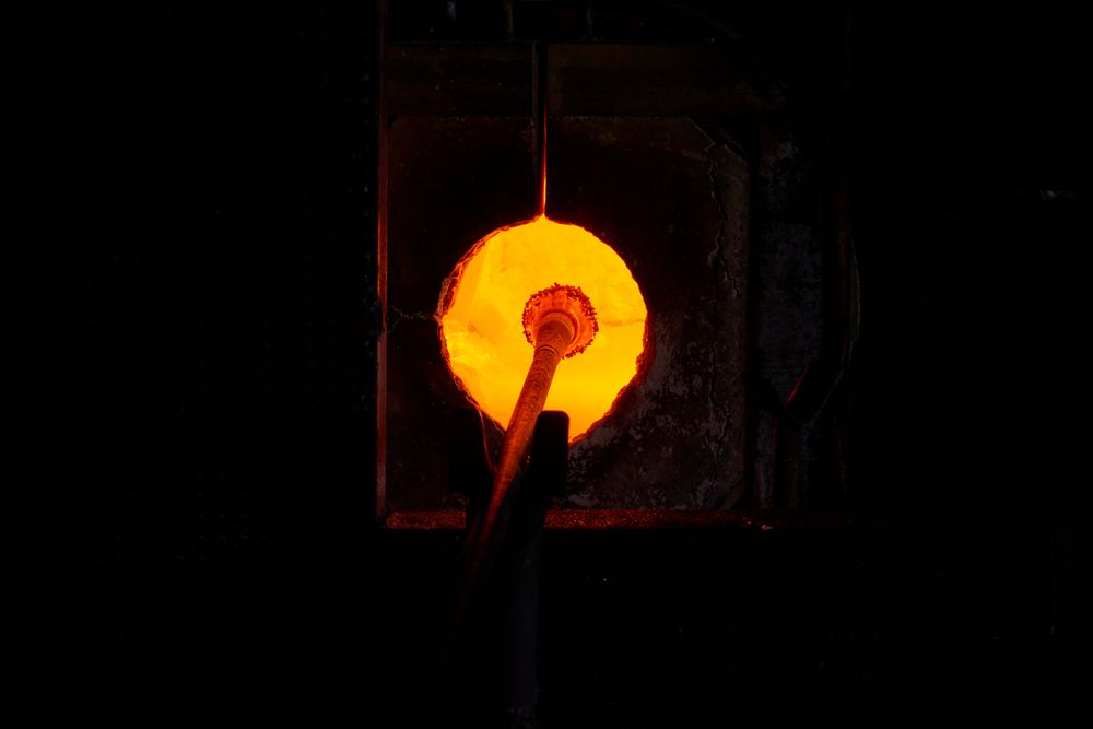 Anonymous master heating up glass in oven