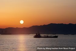 Orange sunrise over a boat in Japan 5n9YZ0