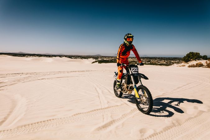 Dirt biker riding in desert