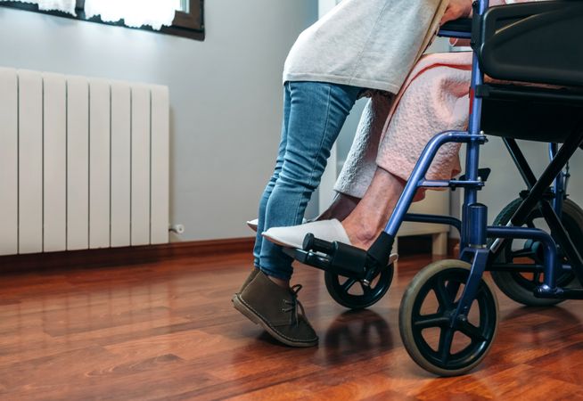 Granddaughter visiting her grandmother in wheelchair