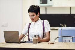 Female in loft apartment on working at home