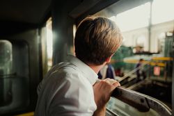Traveler looking out train window