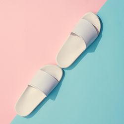 Painted flip flops with pastel pink and blue background