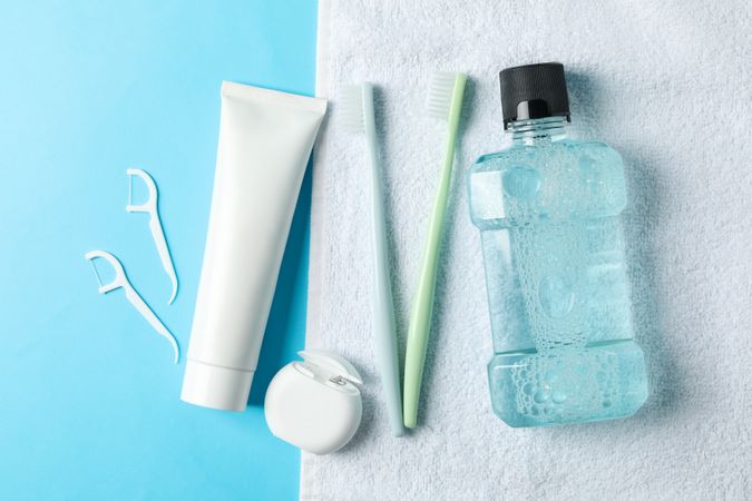 Tools for dental care on blue background