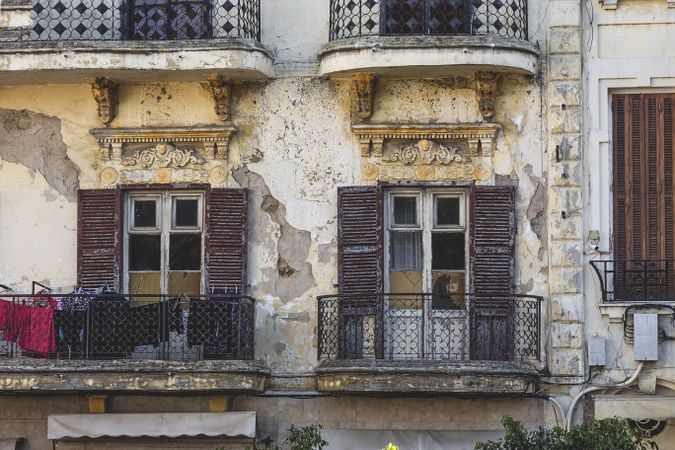 Old retro facade of building with balconies