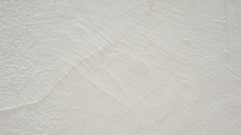 light concrete wall with smooth plaster texture and minimal aesthetic