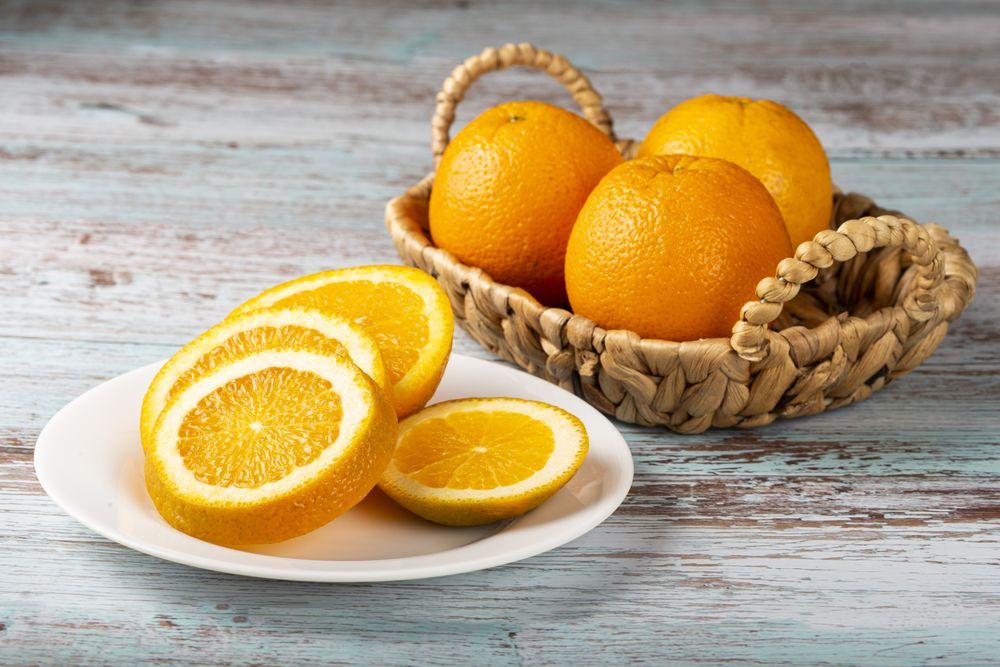 Sliced oranges on the table.