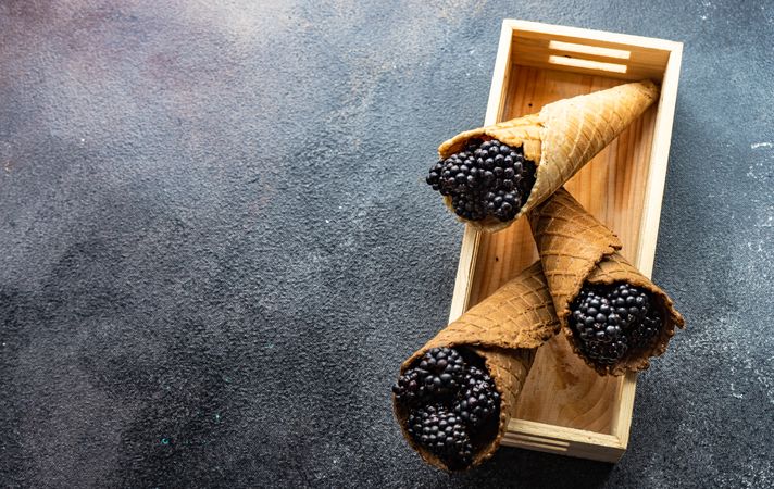 Blackberries in waffle cones