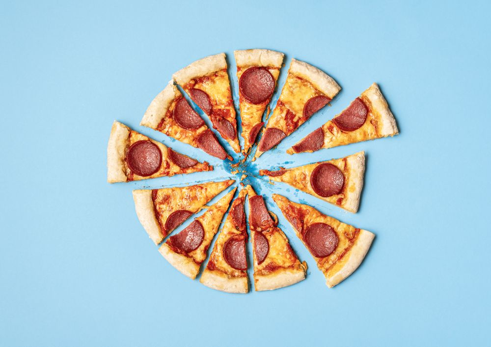 Messy sliced salami pizza