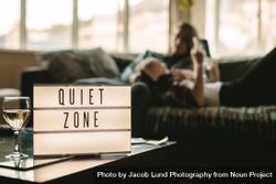 Couple on couch relaxing in quiet zone at home 5r2W15