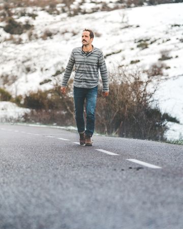 Man walking on country road