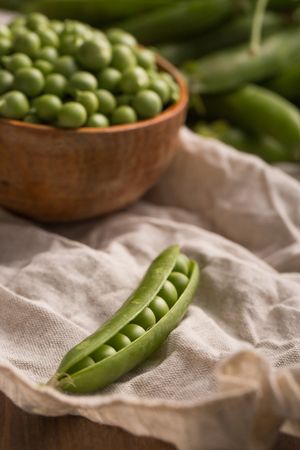 Peas in a wooden scoop