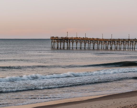 Wooden pier over looking the sky at dawn