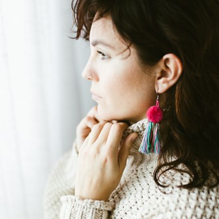 Portrait of woman with handmade earring