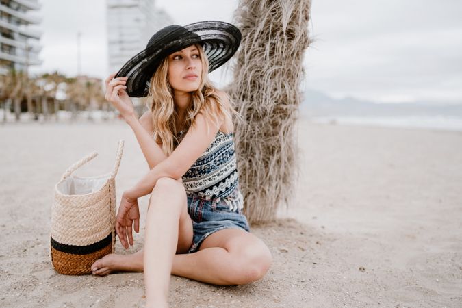 Young female relaxing on beach