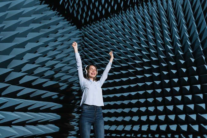 Woman in sound room listening to music