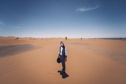 Bearded cowboy in desert