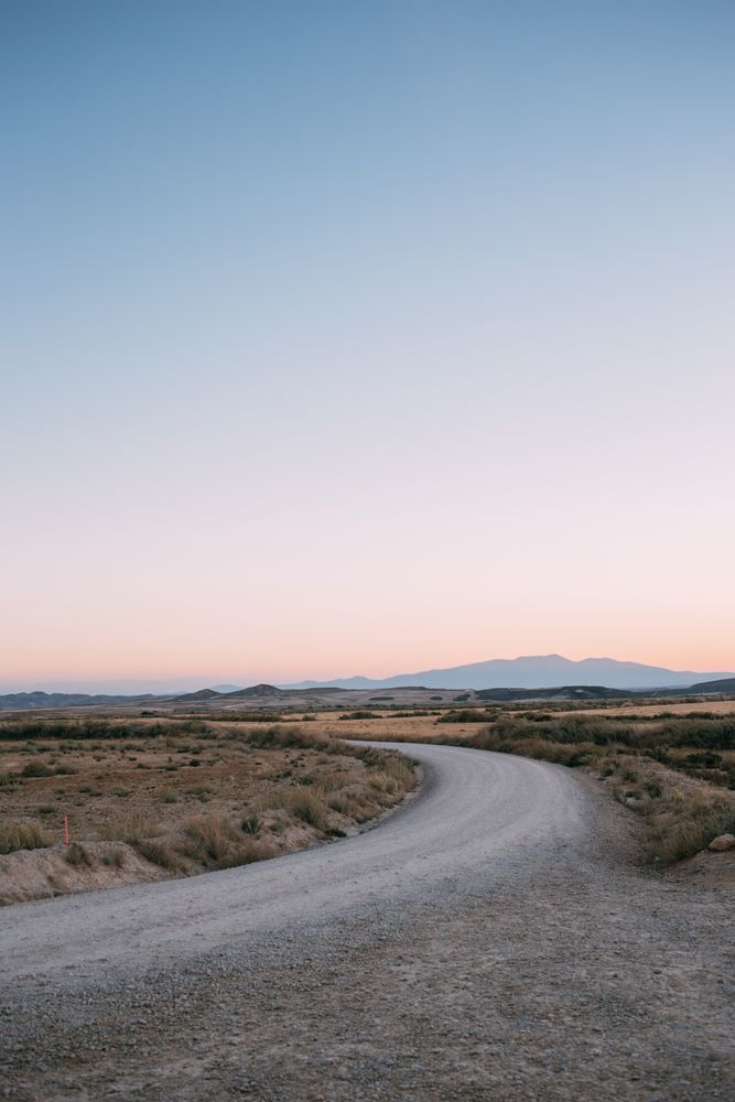 Sunset over bend in the road, portrait