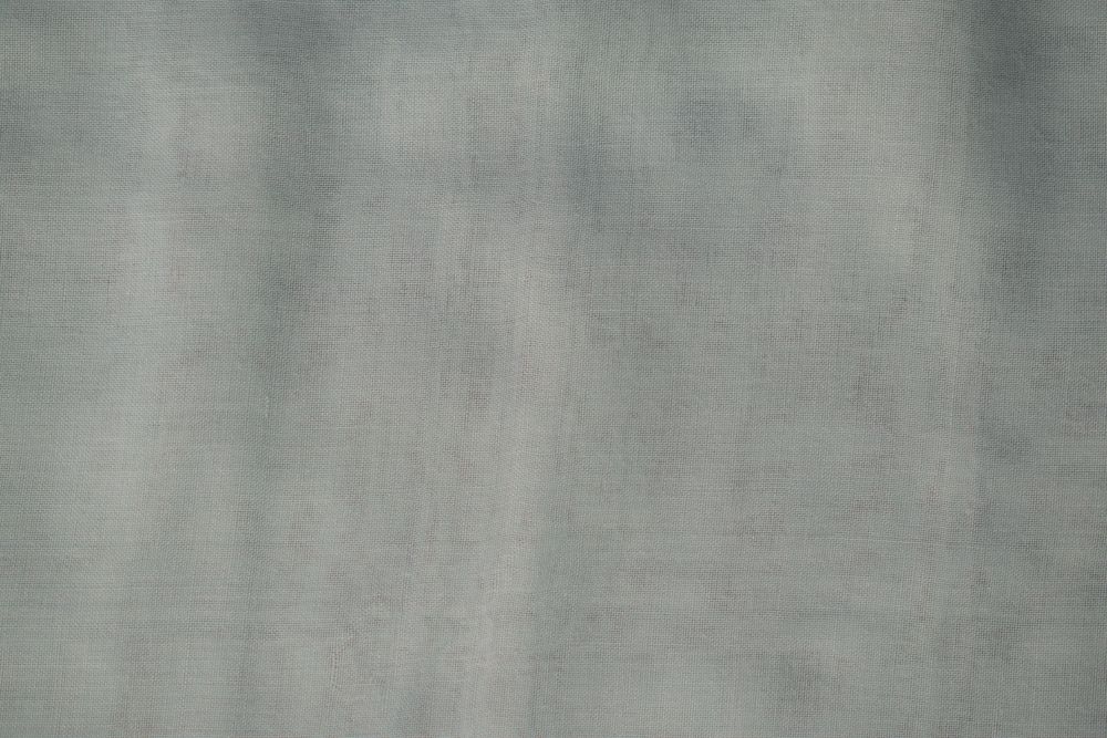 Nude green fabric background texture.
