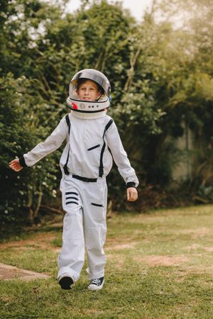 Kid pretending to be an astronaut