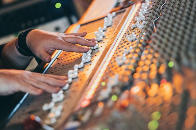 Man in a equalizer instrument in a studio