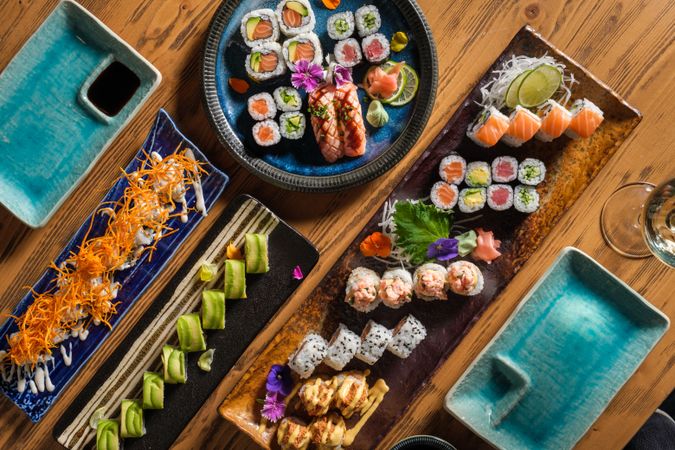 Delicious sushi rolls on table