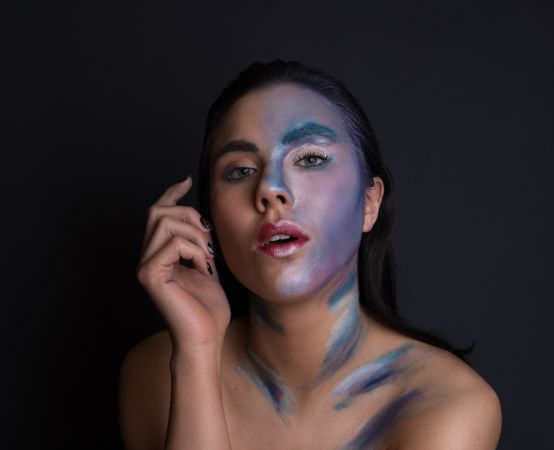 Young woman with painting face