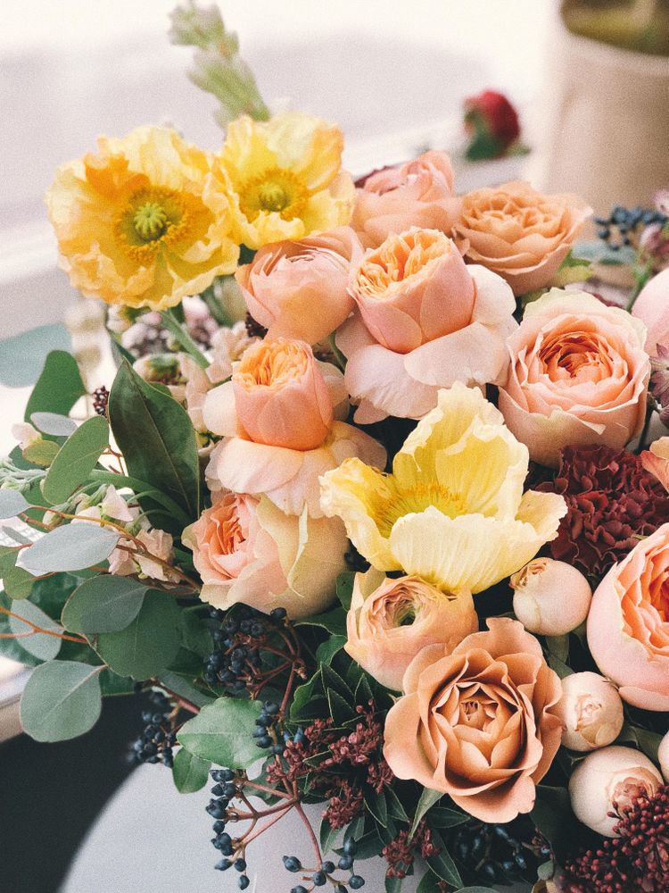 Yellow and pink roses in vase