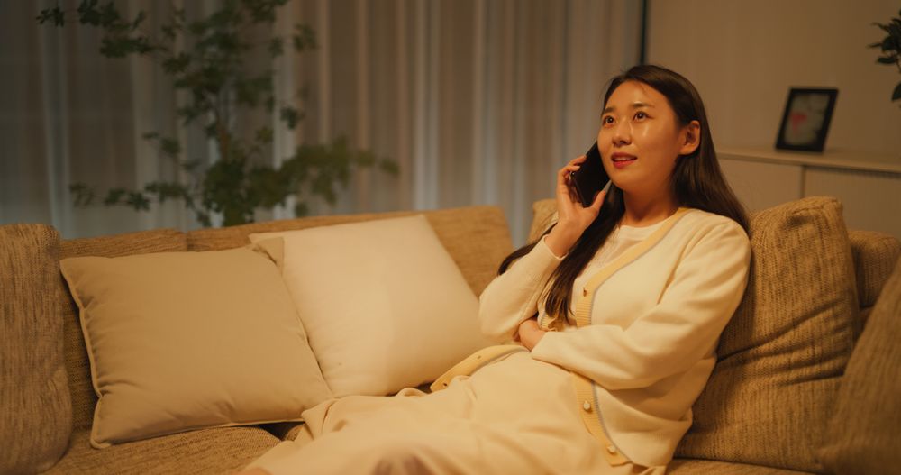 Relaxing on a Couch in the Evening in a Cozy Apartment