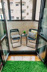 Terrace with two chairs and a small table