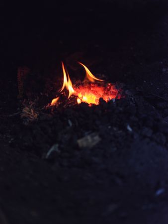 Burning fire in forging furnace in workshop