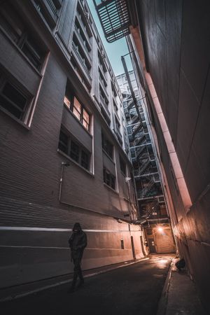 Person walking in an alley