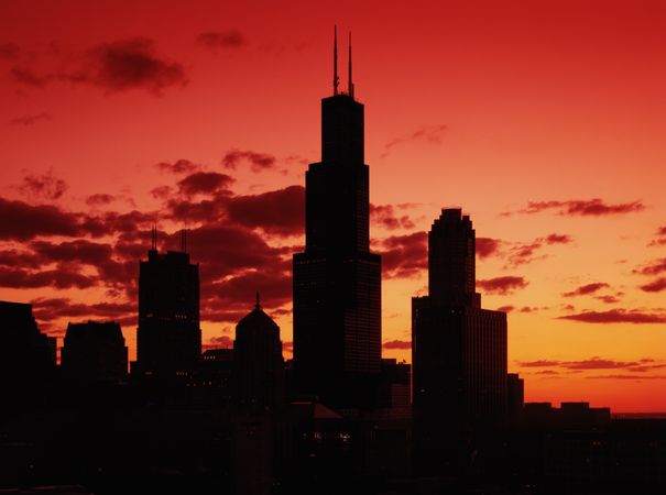 Chicago's skyline appears in silhouette at sunset
