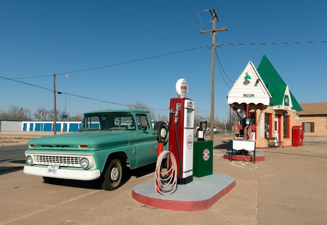 A vintage Chevrolet and restored old Sinclair gasoline station in Snyder, Texas