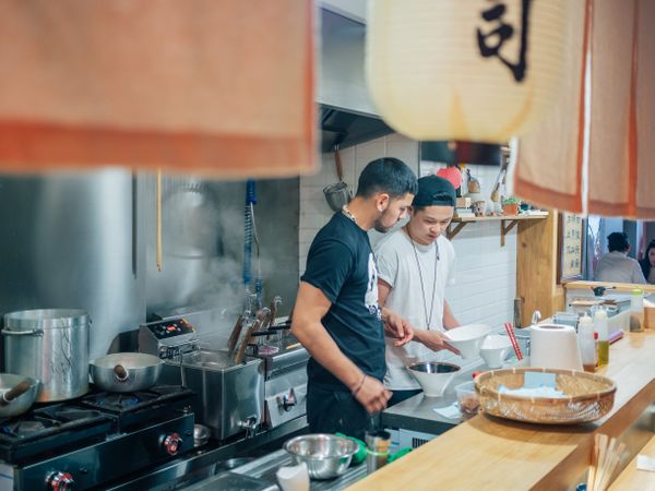 Kitchen staff in Asian cafe