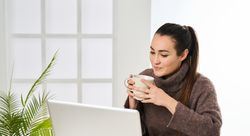 a woman working on the laptop talking on video call