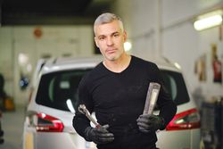 Male mechanic with tools in garage