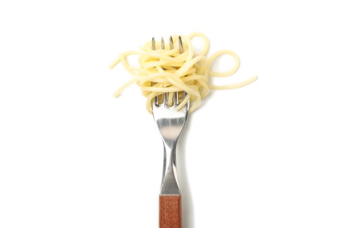 Fork with tasty pasta isolated on plain background