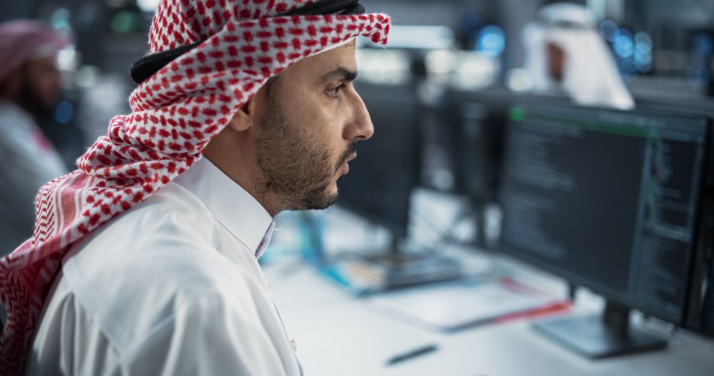 Portrait of a Middle Eastern Engineer Working on Desktop Computer in a Technological Office Environment.